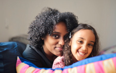 portrait of mother and daughter embracedの写真素材
