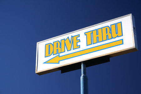 Drive Thru Restaurant Sign and skyの写真素材
