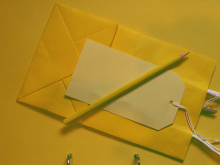 Party planning with gift bags and pencils and labels overlay shot