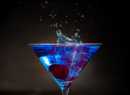 cocktail glasses with different flavors and colors with splash effectの写真素材