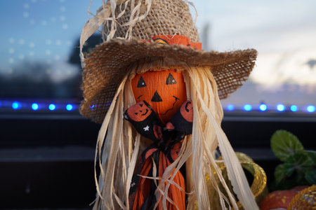 A selective focus of funny scarecrow against a blurred backgro
