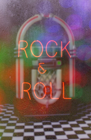 Jukebox with Neon Sign in Rainy Windowの写真素材