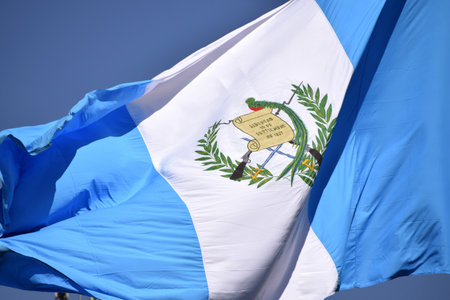 Flag of Guatemala, declared a national symbol on August 17, 1871, coat of arms waving in the wind.