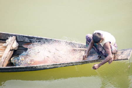 A small fishing boat in small riverの写真素材