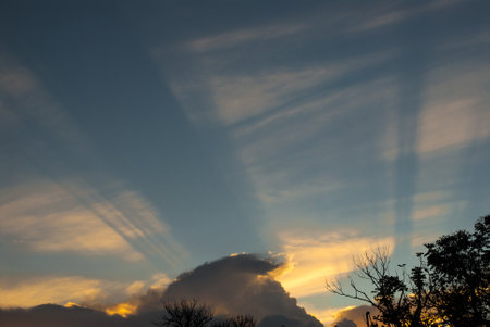 Big Cumulonimbus clouds over rural Guatemala at sunset, blue sky, dramatic image.