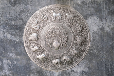 Thai horoscope carved in silver, Chiang Mai, Thailand.の写真素材