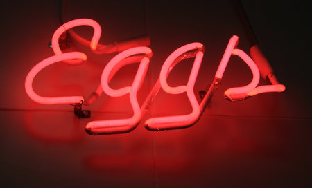 Neon Eggs Sign on Market Buildingの写真素材