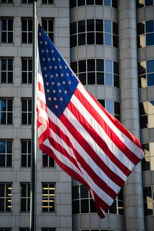 A San Francisco USA American Flag with buildin g in the background