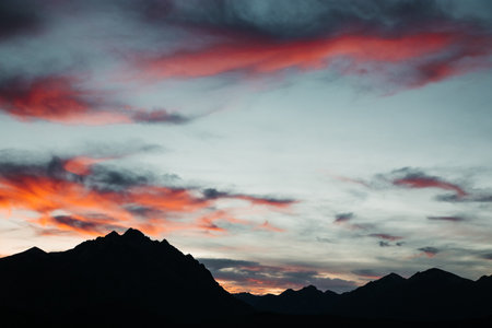 A beautiful shot of the colorful sunset over mountains