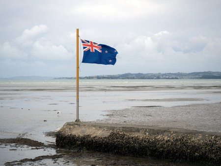 View of New Zealand flag on beachの写真素材