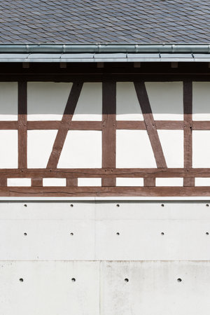 A vertical shot of a building under construction with brown stripesの写真素材