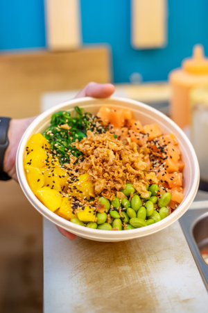 A vertical shot of a healthy fresh dish with slices of salmon and vegetables