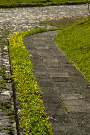 Sidewalk in street in Antigua Guatemala, natural light at dawn, outdoor concrete walk, public space in central america.の写真素材