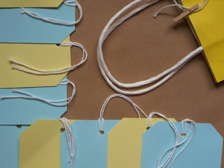 Gift bags and labels flat lay background overhead medium shotの写真素材