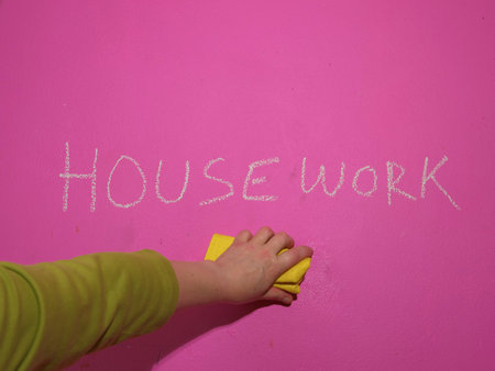 Hand cleaning housework chalked on the wall wide shotの写真素材