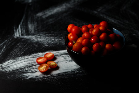 A closeup shot of a bowl full of cherry tomatoesの写真素材