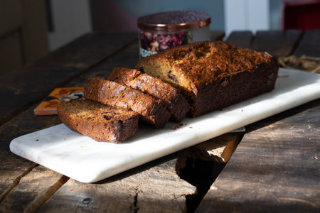 A closeup of a freshly baked chocolate cake on a wooden surface