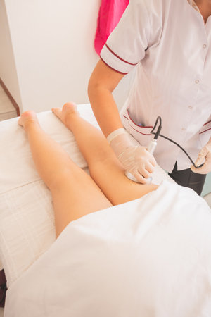 Young Woman enjoying a day at the Spa, to take care of her body. Carrying out different procedures for the reduction of measures.の写真素材