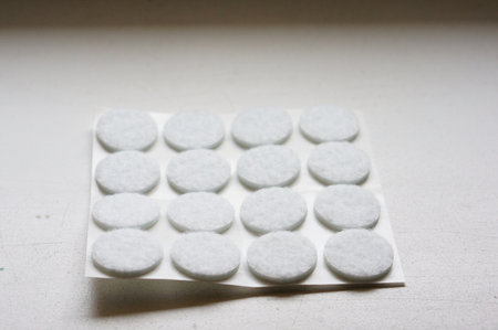 A pad of soft white circle-shaped sticky pads