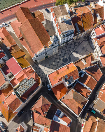 Aerial view of an old little square in Seixal old town with a city church, Seixal, Portugal.の写真素材