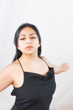 Young woman practicing ballet steps smiling for the camera. Developing everything she learned to be a professional dancer.の写真素材
