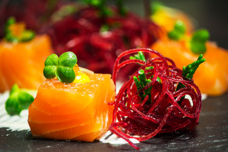 Salmon with beetroot on black backgroundの写真素材
