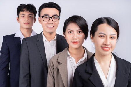 Group of Asian business people posing on a white backgroundの写真素材