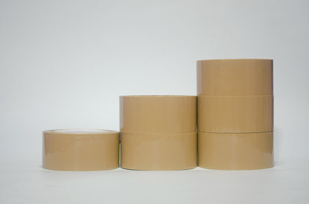 Brown tape on white background. Used for closing parcel boxes.の写真素材