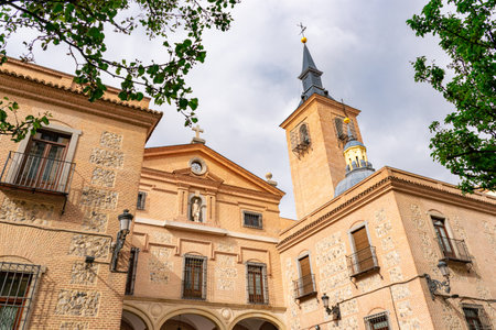 Main facade and bell tower of the Church of San Gines (Iglesia de San Gines de Arles) in Madrid, Spain.の写真素材