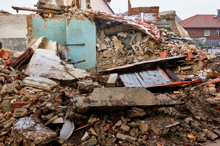 Remains of a residential building after a disorderly and non-selective deconstruction with mixed types of garbageの写真素材