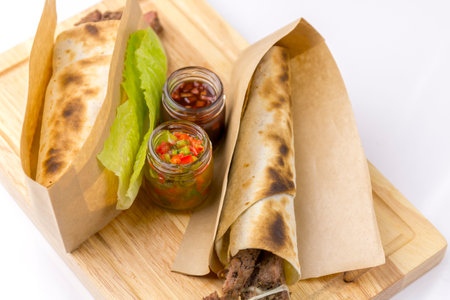 tortilla with mutton on a cutting boardの写真素材