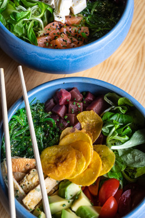 Hawaiian poke bowl with salmon and tuna. Vertical pictureの写真素材