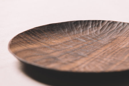 Close-up of wooden plate on white backgroundの写真素材
