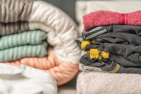 Close-up view of clean laundry folded on a laundry table. Laundry concept.の写真素材