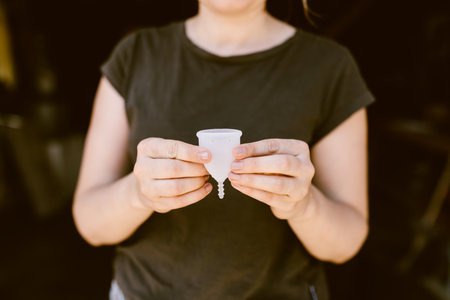 woman holding a menstrual cupの写真素材