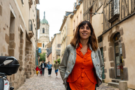 A young tourist at the medieval half-timbered houses in Rennes. Capital of the province of Brittany, Franceの写真素材