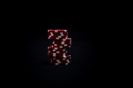 Stack of poker chips on black backgroundの写真素材