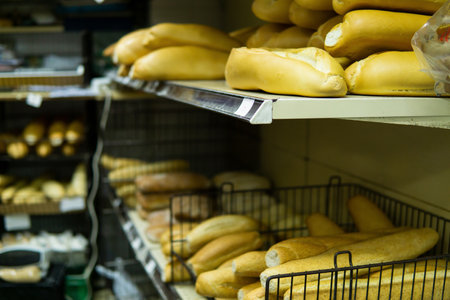 Shelf with bread on display in a traditional food market.