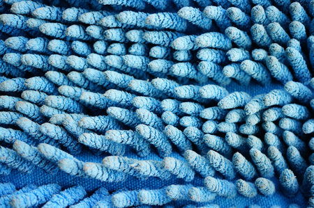 Close up of a blue cleaning mop