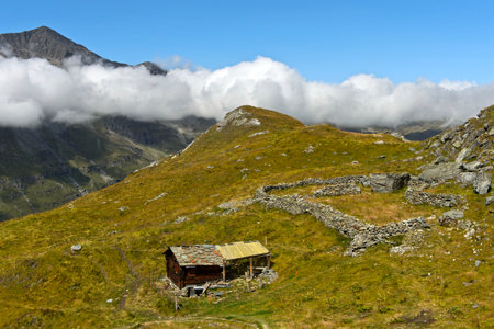 Alp with alpine hut and sheep pen, Val dâAnniviers, Zinal, Wallis, Switzerlandの写真素材