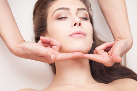 woman face massage closeupの写真素材