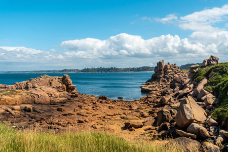Coast along Lighthouse Mean Ruz, port of Ploumanach, in the town of Perros-Guirec, Cotes-d'Armor, in French Brittany, France.の写真素材