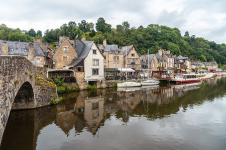 Houses and boats on the Rance river in Dinan medieval village in French Brittany, Franceの写真素材