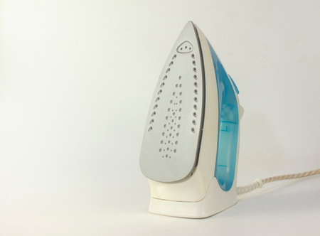 Electric Steam iron on white background. Empty copy space for text.の写真素材