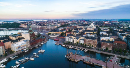 Aerial drone view of the cityscape, North harbor and churches of Helsingfors, sunny summer morning sunrise, in Helsinki, Uusimaa, Finlandのeditorial素材