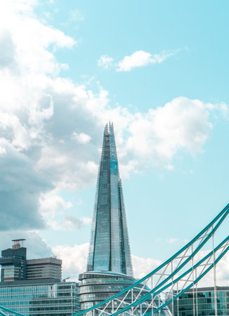 A vertical shot of The Shard in Southwark, London on a beautiful cloudscape background