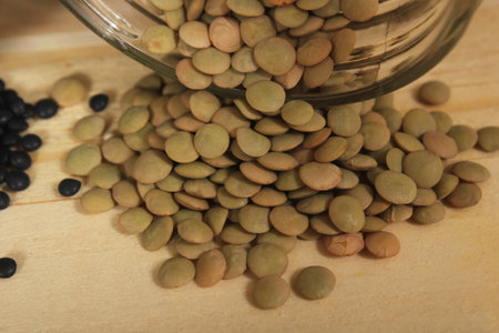 Black, Green and Orange Lentils on Wooden Table
