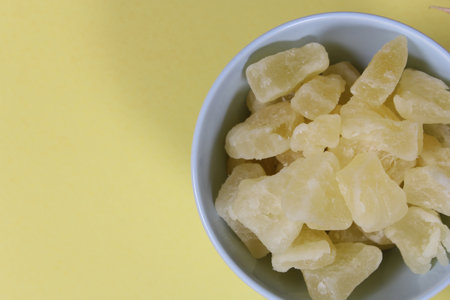 Fresh and Dried Organic Pineapple on yellow Background Closeupの写真素材
