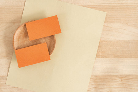 Clean minimal business card mockup on wooden plate background.の写真素材