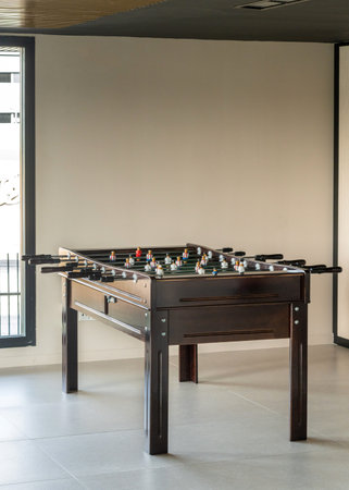 Table football game in a beige room